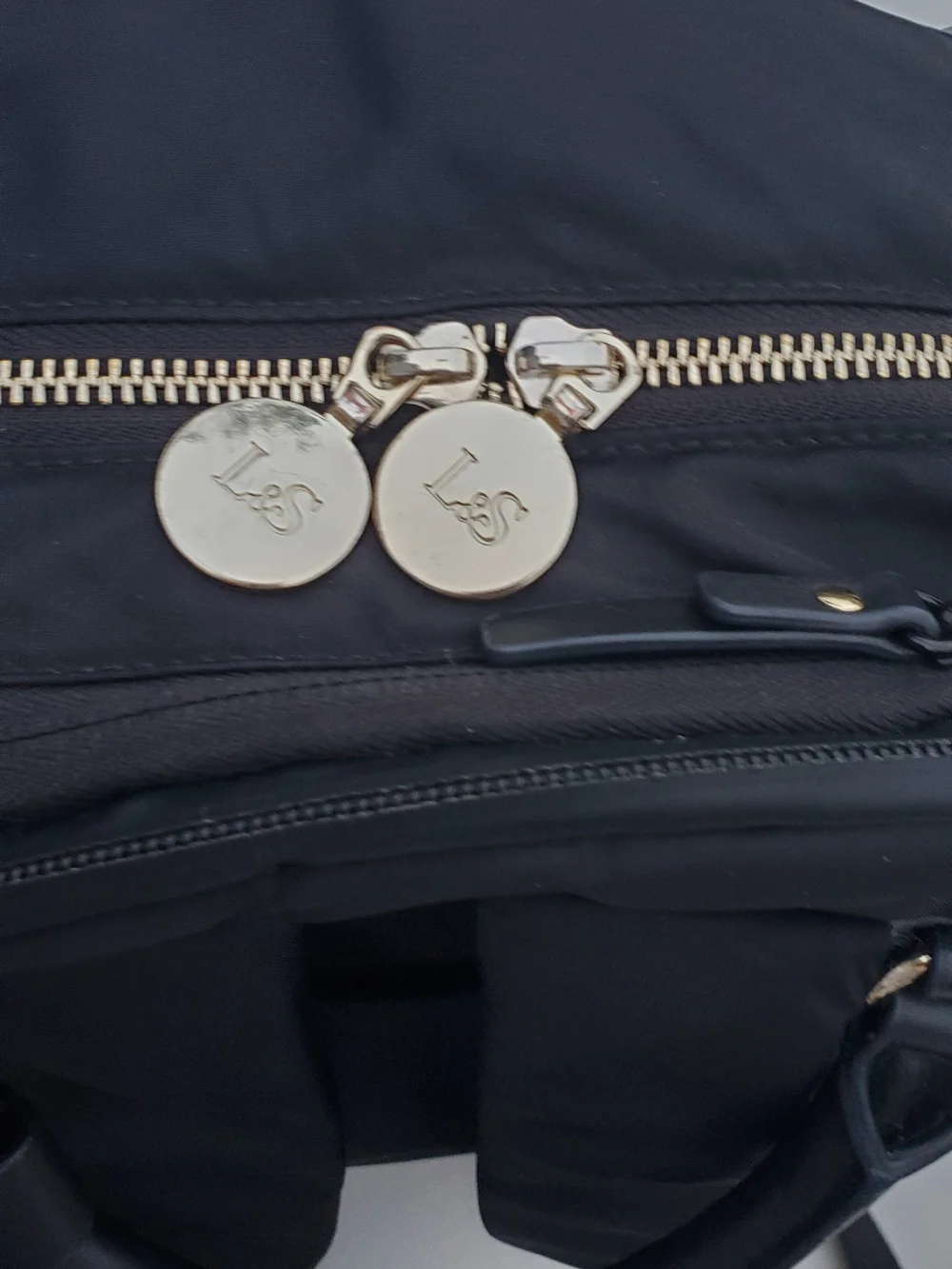 Lo & Sons Black Backpack with Gold Zipper Accents